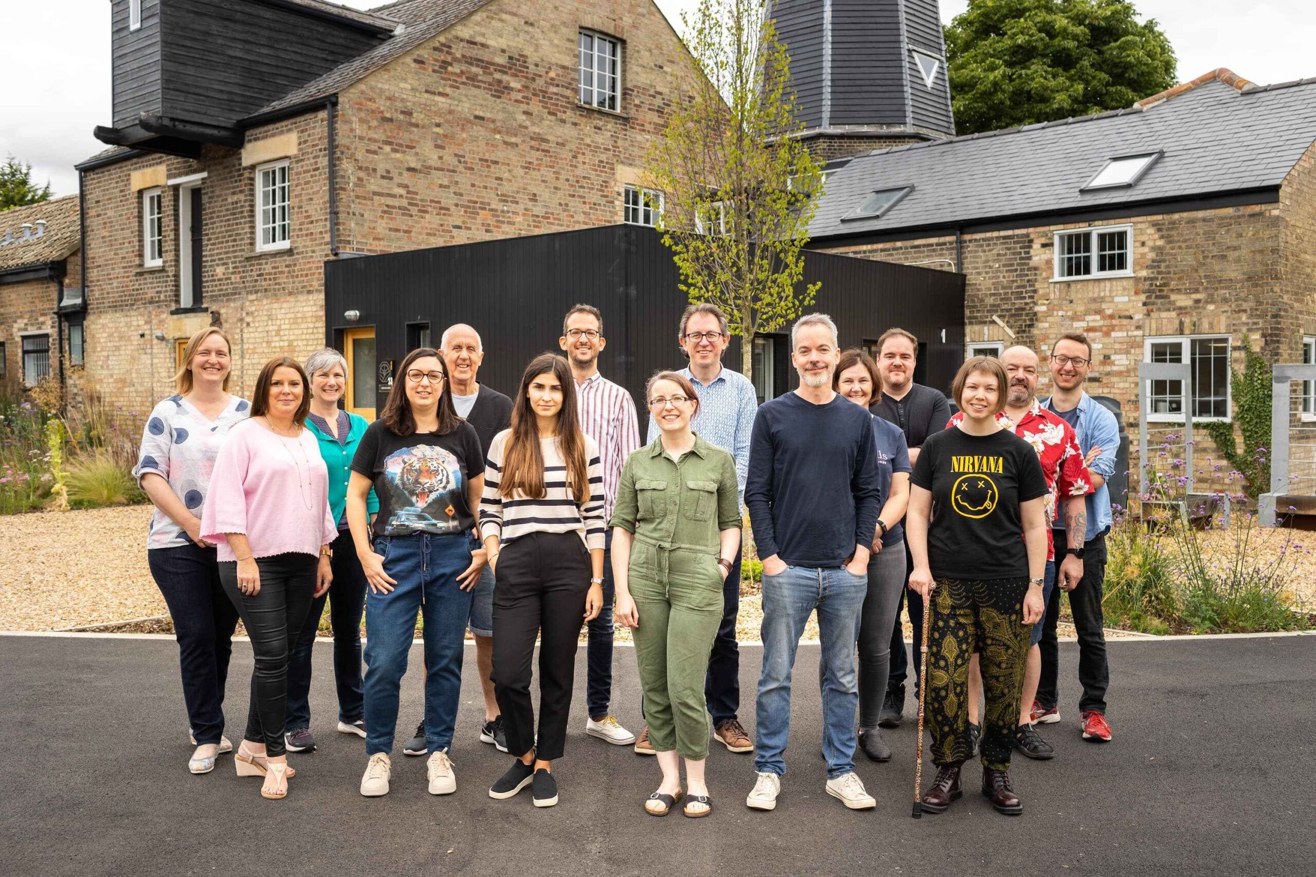 The Studio 24 team standing infront of the old mill building at Chesterton Mill, our UK headquarters