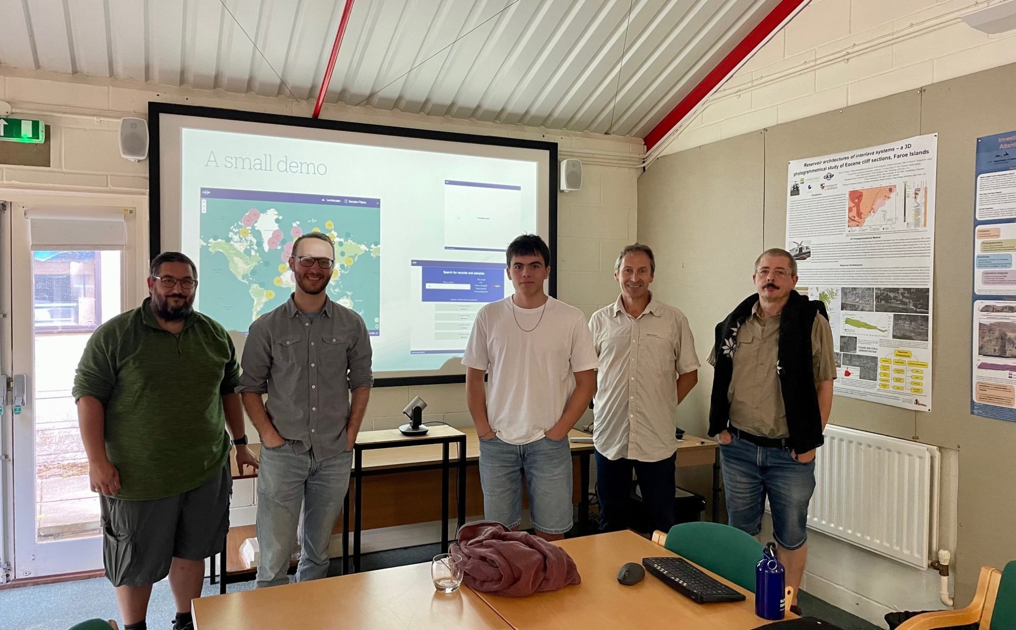 In a meeting room, Sean and Ben from Studio 24, with Simon, Mike and Benoit from CASP.