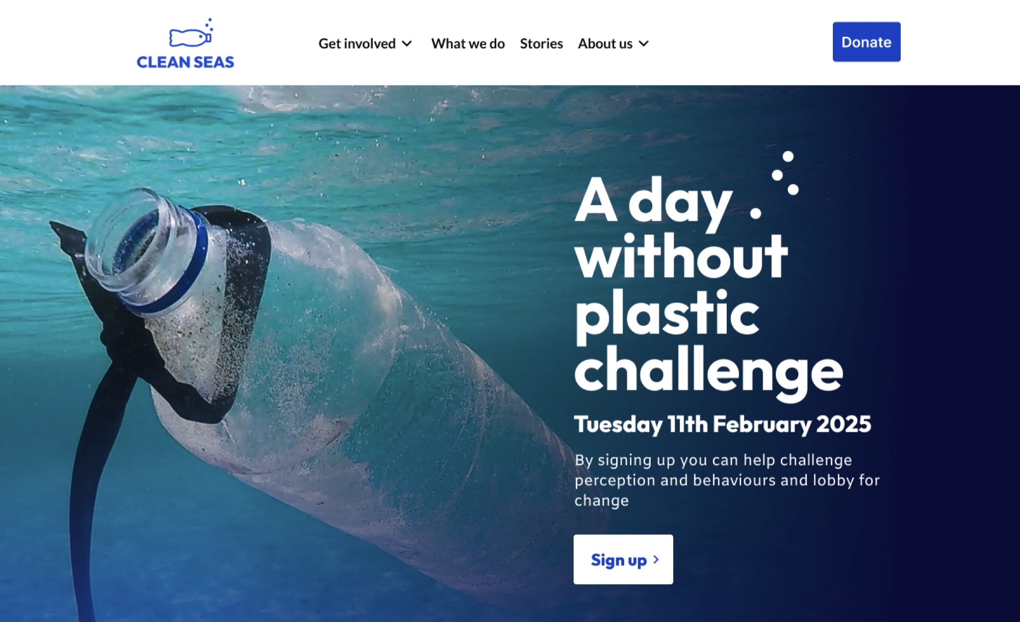 The main focal point of the background image - the floating plastic bottle - is on the left, making space for the hero text and sign up link on a, darker area on the right. A horizontal bar with a white background has been added across the top of the header, to hold a blue logo, a navigation menu with multiple links and a visually distinct donate link