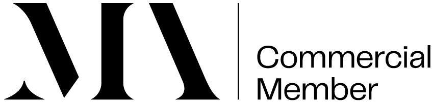 Black large serif font for MA, then commercial member in a smaller sans serif font